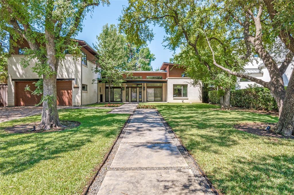 Updated modern stunner on 80x180 treed lot in coveted Bluffview Estates.  Entertainer's dream with a 12 ft ceiling great room, designer lights, custom walnut and zebra wood screen, floating metal stairs, 2 fireplaces, and new Trex patio over looking pool size yard. PRO kitchen equipped with custom cabinetry, 60 inch Wolfe range, Sub Zero refrigeration, steamer, coffee station, prep area with built in cutting board.  Main level has primary suite, secondary bedroom, plus dedicated office.  Second level has two bedrooms, large game room equipped with kitchenette and covered balcony.

2024 Updates: Entire new metal roof, fresh paint throughout, Trex deck, re stained white oak floors, primary bath, landscaping, and much more. Buyer to purchase new survey.