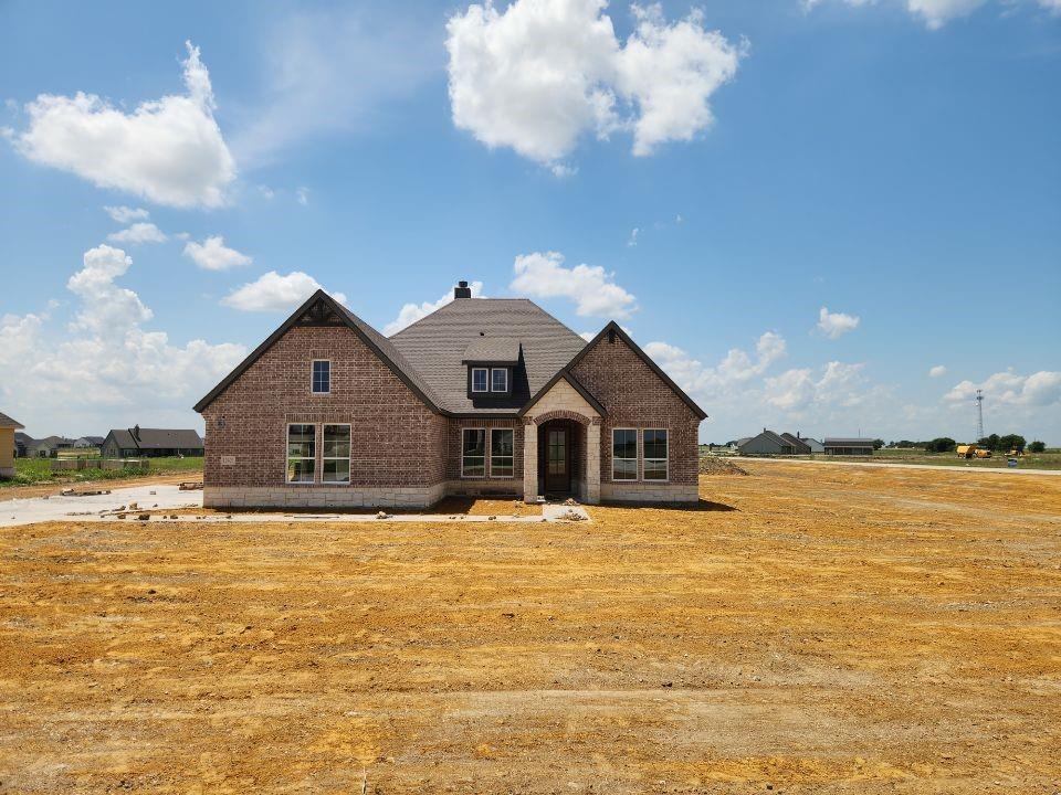 Estimated June 2026 completion! Ask us about our Trade In Trade Up program, we can buy your home! The Verbena floor plan features a modern, open-concept layout and the sought-after features today’s homeowners are searching for. With four bedrooms, three bathrooms, and a flex room, this plan boasts just over 2,400 square feet of functional living space. Upon entering the home off the front porch, you’re welcomed by an inviting foyer. Immediately to the left is a hallway with a bedroom, walk-in closet and full bathroom, as well as a linen closet. Across the foyer is a flex room, perfect for a home office, formal dining room or whatever need your family has for the space. Past the foyer is the family entry, with storage space and mud bench, which leads to the laundry room and two or three car attached garage. Through the entrance, the home opens up to a large family room with a stately fireplace. Adjacent to the family room is a gourmet kitchen, equipped with a walk-in pantry, ample counter space and an oversized island. Finishing off this open-concept living area is a dining space which overlooks the covered back patio. The remainder of this one-story floor plan is just off the living space. A hall leads to two bedrooms with walk-in closets, another linen closet and a shared full bathroom. The back corner of the home offers privacy for the owner’s suite, featuring a massive walk-in closet and bathroom with a dual-sink vanity, standalone soaking tub and glass-enclosed shower.