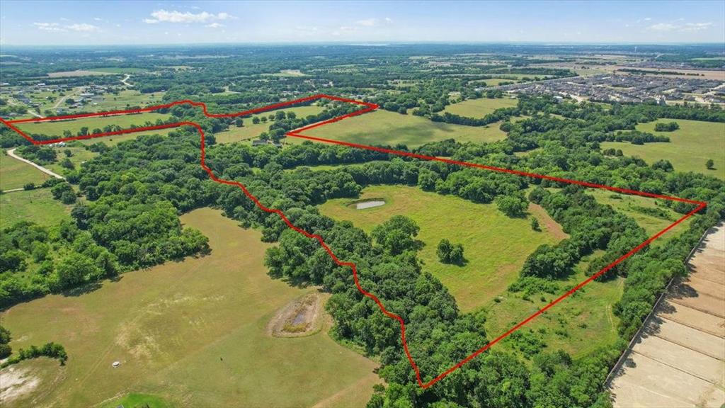 LOCATION! LOCATION! LOCATION! PRIME ACREAGE in the ever-growing City of McKinney, TEXAS. This property is heavily treed offering great upscale opportunities for developing City Lots, Estate lots or both. As a developer your New Subdivision or Investment Project can offer attractive options just minutes from the Historic Downtown McKinney. The City of McKinney has not missed a beat when it comes to investing in its growth and expansion, building this Historic Downtown District into a Destination, catering to both families and individuals looking for both Upscale or Relaxed Dining, Shopping and Entertainment. The new McKinney Airport, offering the Business Traveler additional attractive options, will be minutes away. McKinney Independent School District is Highly Rated and is the 2025 NICHE BEST OF SCHOOLS.
This Beautiful Canvas of Land can bring the Art of your Vision as a Developer to LIFE!! Numerous opportunities await for you to breathe life into  a New Community with Residential Living offering an array of amenities such as Pools, a Lagoon, Picnic Spaces, Pickel Ball Courts, Fishing Ponds and Walking Trails or Equestrian Style living with Homes, Horse Barns, Riding Trails and Equestrian Arenas with Stables or a 55  and over Community offering Senior Amenities and in close proximity to Baylor Scott and White and Medical City of McKinney . This new COMMUNITY TO BE offers easy access from Highway 5 and highways 380 and 121.