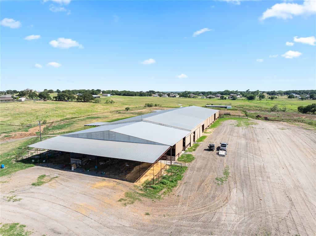 Horesman here is the perfect horse set up. 105 acres of good grasses and sandy loam dirt, 120 x 480 covered arena with stalls and wash rack. The arena is 120 x 300 .Stalls and wash rack take up 120 x 100. At each end of building is a 40' x 120 ' covered area, set of pens on south end with extra storage on the north end that is 40 x 120. Pastures have mature oak and native pecan with some really good grasses for the animals. Mens and womens bathrooms by arena. water well by barn.