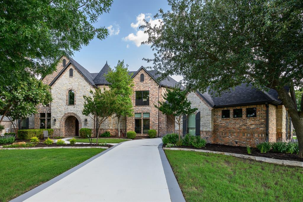 This stunning 5,820 Sq. Ft. custom estate in the prestigious Whispering Farms neighborhood blends modern luxury with spacious comfort on 1.65 acres. The open layout features expansive windows, flooding the home with natural light. The gourmet kitchen, equipped with Sub Zero and Thermador appliances, is perfect for entertaining. The master suite offers a spa-like retreat with a soaking tub and double-entry shower. Upstairs, enjoy a game room, 3 spacious bedrooms, and en-suite bathrooms. The media room, study, and home gym add versatility. Outdoors, experience resort-style living with a pool, fire features, putting green, and outdoor kitchen with a grill and fridge. The 4-car garage and ample storage complete this dream property, offering both privacy and luxury just steps from your backyard paradise.