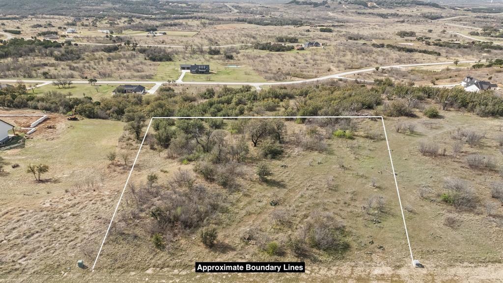Sprawling two acre lot atop one of the highest points in The Hills Above PK. Bring your builder and design your dream home on this awesome lot with views sprawling for miles over the Palo Pinto Mountains!