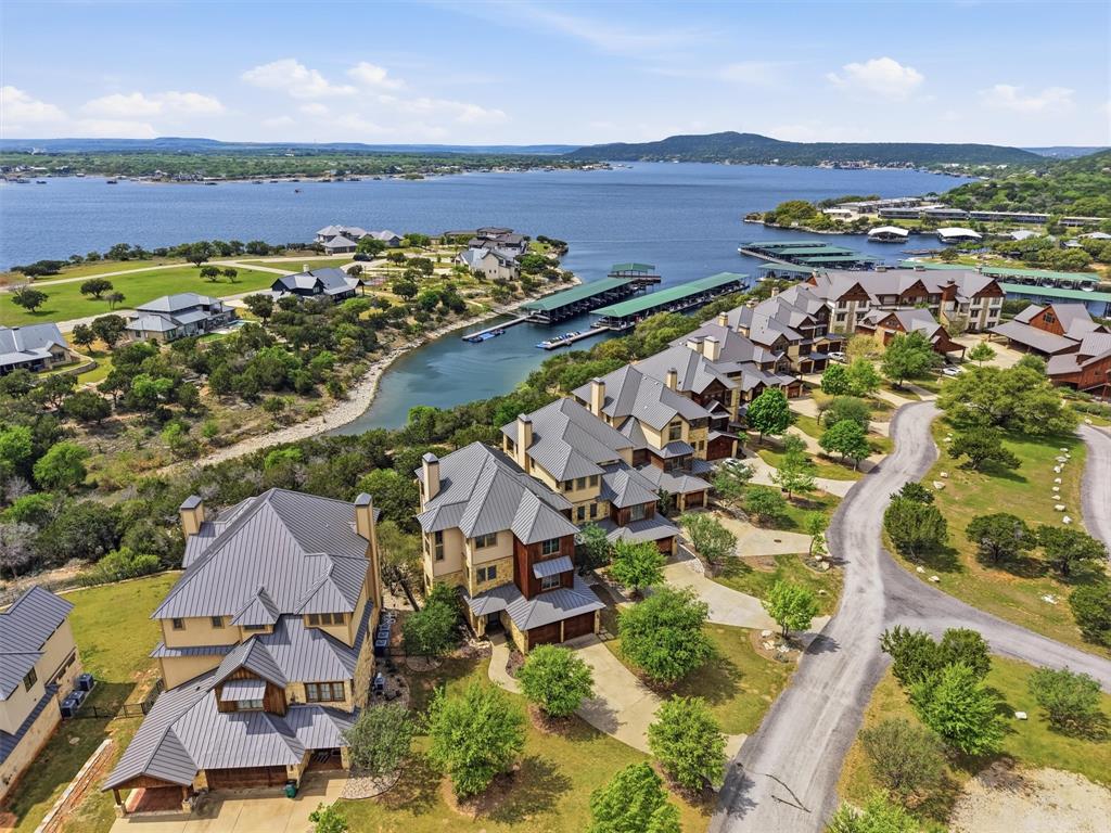 Experience the best of lake living in this exceptional home located in the highly sought-after Harbor community. Perfectly positioned to capture stunning lake views, this fully furnished residence offers a seamless blend of luxury, comfort, and convenience.

Designed with both entertaining and relaxation in mind, the home features **5 spacious bedrooms—each with its own private en suite—**including multiple primary suites, ideal for hosting family and guests. Two expansive living areas provide plenty of space to gather, unwind, and enjoy the lake lifestyle.

Step outside to your private backyard retreat complete with a spool, perfect for cooling off after a day on the water while taking in the breathtaking views.

Offered fully furnished, this home is truly turnkey and ready for immediate enjoyment. Located just a short walk from the marina, you’ll have effortless access to boating, dining, and everything the Harbor has to offer.

Whether you're searching for a full-time residence, or a weekend escape, this property checks every box.