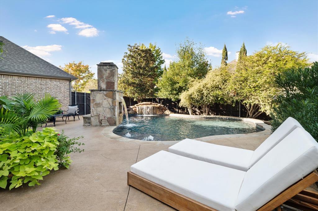 This beautiful 5-bedroom, 4-bathroom gem with a 3-car tandem garage is nestled in the highly sought-after Starcreek subdivision. As you step inside, you'll notice fresh paint throughout the home and brand-new carpet on the first floor, giving it a neutral and pristine feel.

The first floor boasts a primary suite and a secondary bedroom or office, offering versatility. Upstairs, you'll find three more spacious bedrooms, accompanied by a game room and a home theater. 

The showstopper– the stunning backyard oasis. Mature privacy trees create a serene atmosphere, framing the Gunite pool with a grotto and waterfall. There's even a cozy fireplace for those chilly evenings, making it an entertainer's dream.

The large wall of windows in the family room and dining area draws your gaze out to this backyard paradise, filling your home with natural light and a sense of tranquility. Close proximity to shopping, dining, and easy highway access. Schedule your showing today!