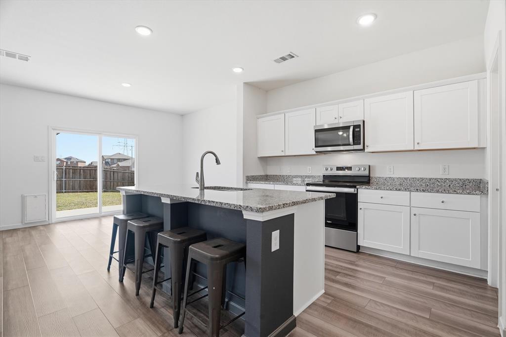4.75% VA Assumable Loan for Qualified Buyers! Situated on a desirable corner lot, this beautifully maintained home offers a functional layout, modern updates, and plenty of space for everyday living and entertaining. The open-concept floor plan creates a seamless flow between the main living areas, making it perfect for gatherings or relaxing at home. The updated kitchen is a standout feature, complete with stylish shaker-style cabinetry, granite countertops, stainless steel appliances, and a large island that provides additional prep space and seating. A spacious walk-in pantry ensures ample storage and organization for all your kitchen essentials. Luxury vinyl plank (LVP) flooring runs throughout the kitchen, hallways, pantry, and bathrooms, offering both durability and a cohesive, modern look. Dedicated downstairs home office—ideal for remote work, studying, or a quiet retreat. Upstairs, a versatile second living area or game room provides additional space for entertainment, hobbies, or a media setup. The conveniently located upstairs laundry room adds ease to your daily routine. Step outside to a generously sized backyard with endless possibilities. Whether you envision hosting summer barbecues, creating a play area, or adding a pool, this outdoor space is ready to accommodate your lifestyle. Located in the lovely Panther Heights community in Fort Worth, this home offers easy access to major highways, making commuting a breeze. You’ll also enjoy being just minutes from a variety of shopping, dining, and entertainment options. This home combines comfort, style, and convenience—don’t miss your opportunity to make it yours!