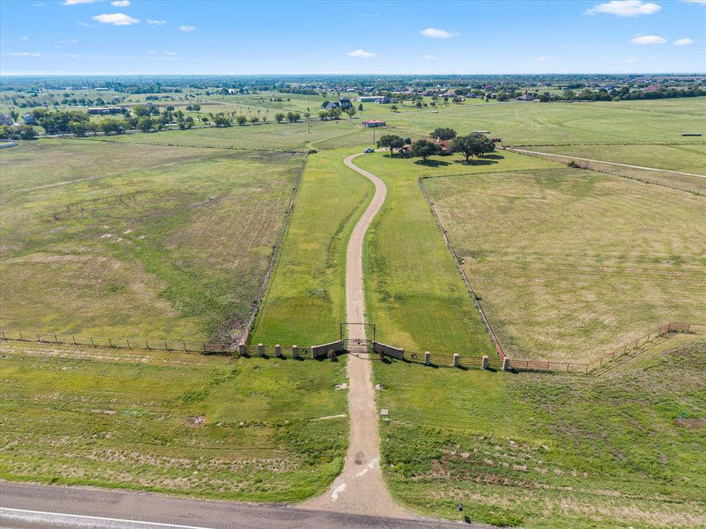 Located in Royse City,one of the fastest-growing cities in the United States, and within Rockwall County, one of the top growth counties in Texas, this 206± acre ranch sits 50 miles east of Dallas and offers exceptional scale, access, and future potential.

With extensive frontage on Hwy 276 and frontage on Streetman Road, and limited frontage on Melody Lane, the property is well positioned for residential, ranchette, or commercial development. The property sits in the Rockwall ETJ, outside city limits, with an 18 inch industrial Cash SUD water line along Hwy 276 and an 8 inch line along Streetman Road. Survey available.

The land features ponds, a creek with minimal FEMA floodplain, scattered trees, and productive pastures suitable for livestock and hay production. Improvements include a main home with guest quarters, three barns, an arena, and multiple outbuildings providing immediate use or interim income potential.

With its impressive size, prime location, strong utility access, and promising growth outlook, this property stands out as a rare opportunity in one of North Texas’s most vibrant corridors. Seller will consider dividing and may offer owner financing for qualified buyers.  Survey Available.
