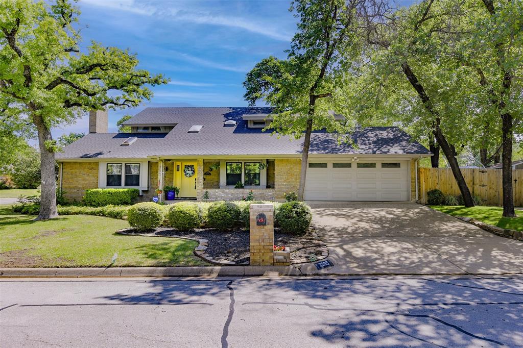 SELLER OFFERING 1% INTEREST RATE BUYDOWN FOR 1ST YEAR WITH ACCEPTIBLE OFFER! Stunning four-bedroom Arlington home showcases impressive updates and sits on desirable corner lot framed by manicured foliage, majestic oak trees and multiple inviting patio places prefect for outdoor living.  This home's expansively designed layout unfolds with a graceful open flow, connecting generous living areas.  Each space transitions effortlessly into the next, creating an ideal setting for hosting large gatherings while still offering an inviting, comfortable retreat perfectly suited for relaxed everyday family living.  Fun, private English-styled library, complete with rolling ladder and cozy fireplace, is the perfect place to enjoy the latest page turner.  The stylish, show-stopping gourmet kitchen was completely reimagined a few short months ago, thoughtfully rebuilt with exceptional attention to detail.  Rich butcher block countertops add warmth and character while providing generous prep space sure to impress even the most discerning chef.  Seamlessly opening into the informal living area inviting connection and conversation, this will be the heart of your home.  Principal suite boasts of French door leading to private balcony, plus sumptuous bath with flexible room for workout area, private office or additional closet or dressing area...you choose.  Privately positioned on the first floor, the split bedroom enjoys direct access to a full bath creating a versatile retreat.  Tucked away from the main living areas, it offers just the right amount of privacy for overnight guests, older children or aging parents.  This quiet location also transitions beautifully into a home office.  Don't miss the additional parking for a third car, boat or RV.   Be sure to review the lengthy list of updates and improvements.  Thoughtfully enhanced and meticulously maintained, this home is truly in move-in condition, allowing you to settle in an enjoy from day one.