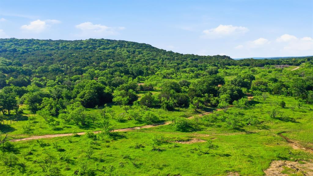 Beautiful 23-acre tract offering the perfect setting to build your dream home in the country! This scenic property features an abundance of mature trees that provide privacy, shade, and a peaceful natural setting. 

Enjoy stunning views of the surrounding hills and wide-open Texas skies from multiple potential homesites. Whether you’re looking for a quiet place to build a permanent residence, weekend retreat, or recreational getaway, this property offers endless possibilities.

Utilities are conveniently available within the development, including electricity and water, though they have not yet been extended directly to the individual tracts. Conveniently located approximately 42 miles from Weatherford, 18 miles from Eastland, 32 miles from Stephenville, and 69 miles from Abilene, this property offers the peace of country living while still being within easy driving distance of shopping, dining, and other amenities.

With a beautiful combination of trees, privacy, and views, this property is a rare opportunity to own your own slice of Texas countryside.