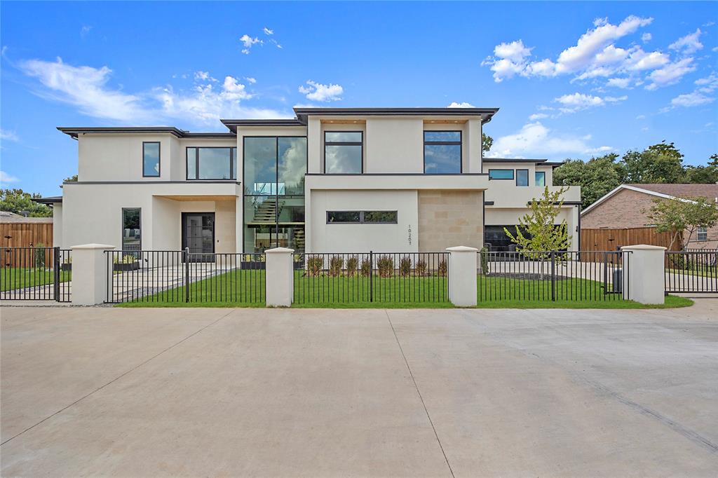 Experience modern elegance in this newly built 6,174 sq ft estate designed for today’s luxury lifestyle. Situated in the Preston Hollow & Midway Hollow corridor, this home combines striking architectural design with everyday comfort. Walls of windows and soaring ceilings highlight multiple living spaces, including a family room, living room, and media room with projector. The chef’s kitchen features a dramatic marble waterfall island, custom cabinetry, and professional grade Thermador appliances, opening seamlessly to dining and entertaining areas with views of the pool. The first floor primary suite is a private retreat with direct pool access, spa-inspired bath, dual vanities, freestanding tub, oversized shower, and two boutique style walk-in closets. Upstairs offers a secondary living area, balcony, and spacious guest suites with en-suite baths. Additional amenities include an office, gym, flex space, two laundry rooms, and a 4-car garage. Smart home features and integrated speakers enhance convenience. Outdoor living is complete with a sparkling pool, covered patio, and summer kitchen.