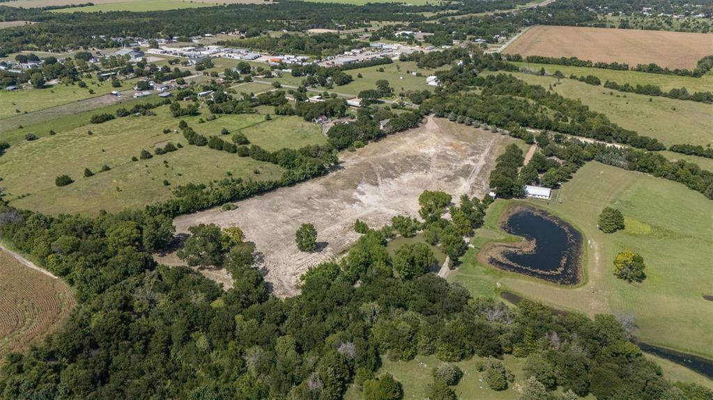 Welcome to 1065 Bluff Springs Road, a versatile property located just outside the city limits of Ferris, TX. This tract offers a rare opportunity for those seeking space, privacy, and flexibility of use—perfect for a weekend retreat, small farm, mobile home, or future development. Situated on a quiet country road with easy access to I-45 and FM?983, this lot provides the ideal balance of rural charm and urban convenience. The open terrain and natural surroundings offer endless possibilities—bring your animals, build a barn dominium, or simply invest in land with long-term value. Whether you're looking for a homesite, recreational space, or a blank canvas for your next project, this property delivers. Don't miss this opportunity to own land in a growing area of Ellis County with strong long-term potential.