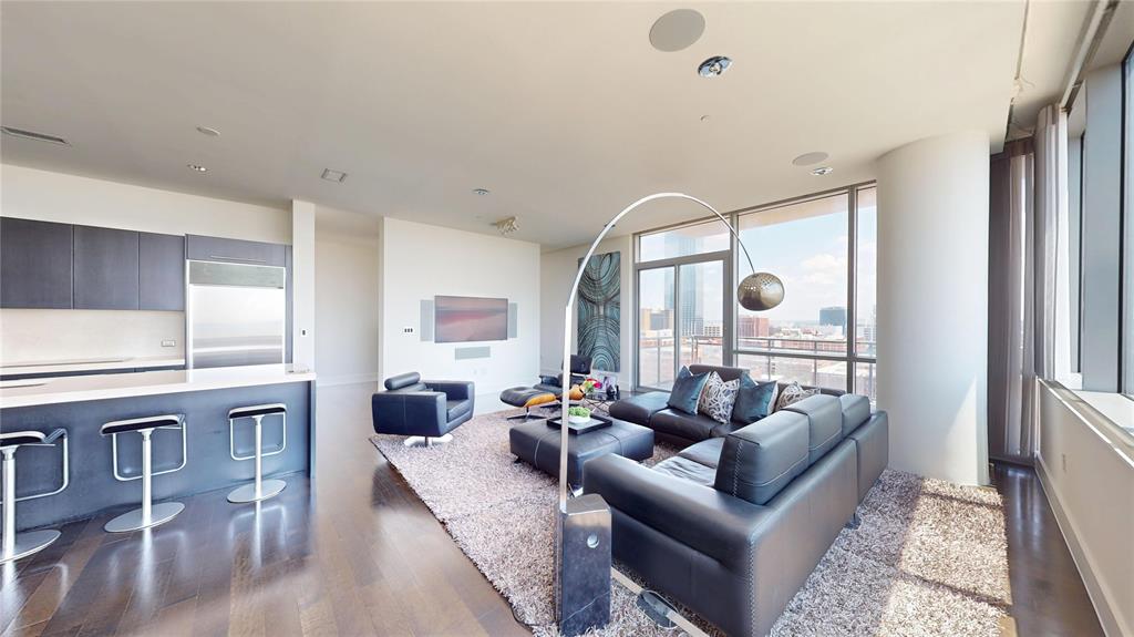 Welcome to a rare opportunity to own one of the largest original floor plans at the iconic Philippe Starck-designed The House in Victory Park. Spanning 2,466 square feet, this exceptional two-bedroom, two-and-a-half-bath residence offers expansive living spaces, an open-concept design, and spectacular 180-degree views of the Dallas skyline, including Reunion Tower and the Margaret Hunt Hill Bridge. Homes of this size rarely become available. The chef’s kitchen is appointed with Wolf and Sub-Zero appliances, elegant Crema Marfil marble countertops, a generous center island, and abundant workspace. Dark hardwood floors, museum-finished walls, and 10-foot floor-to-ceiling windows create a sophisticated backdrop for everyday living and entertaining. The expansive 20’ x 14’ primary suite features an extraordinary custom California Closets walk-through dressing room with its own seating area. Thoughtfully upgraded throughout, the residence includes a fully programmable Lutron lighting system, powered Hunter Douglas shades, and a built-in MartinLogan 5.1 surround sound system with integrated hallway speakers. Included with the home is a rare 140-square-foot private walk-in storage room conveniently located adjacent to two dedicated parking spaces, providing an exceptional level of convenience rarely found in high-rise living. Residents enjoy 24-hour concierge and valet services, controlled-access security, a resort-style pool with private cabanas, a state-of-the-art fitness center, owners’ lounge, and beautifully designed gathering spaces that create a true lock-and-leave lifestyle. Positioned in the heart of Victory Park, the residence is a very short walk from the American Airlines Center, Katy Trail, exceptional dining, and new corporate headquarters defining Dallas’ expanding “Y’all Street” financial district. Unrepresented buyers welcome with proof of funds. Seller Financing available. This home must be visited to be appreciated. More Info at TheHouse1505.com.