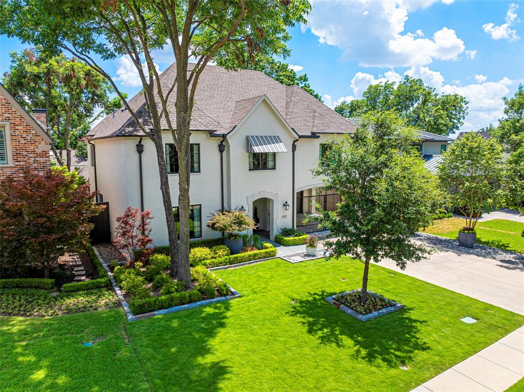 OPEN SUNDAY 2-4. A stunning 2018 transitional home within walking distance of Preston Hollow Park! This 4-bedroom residence offers a downstairs office, an upstairs gym, and a bonus room, along with the convenience of parking for up to 4 cars behind a private gate and an attached front-entry garage. The driveway is beautifully framed by thoughtfully designed planters and trees.  Inside, you’ll find open living spaces adorned with Marvin windows, wainscoting, designer lighting, Schumacher wallpaper, and striking beams that add character throughout. All bedrooms are ensuite, including a guest bedroom conveniently located on the first floor.  The kitchen is a showstopper, featuring Sub-Zero and Wolf appliances, a large marble eat-in island, a coffee bar, a butler’s pantry, and a cozy breakfast area, all seamlessly flowing into the great room.  Perfect for year-round entertaining, sliding glass doors open to a covered patio complete with a fireplace and an outdoor kitchen, ready for any season!