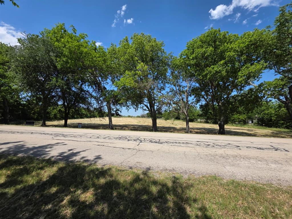 PRIME 2.55-ACRE RESIDENTIAL LOT IN OAK POINT near Denton, Little Elm, and Lake Lewisville. This expansive tract offers a rare opportunity for flexible residential use, including the potential for two separate homes—one positioned toward the front of the property and another toward the back. Based on current information obtained from the city planning department, the property may have the potential for two residential dwellings, making this an increasingly rare opportunity in this highly sought-after corridor where many surrounding parcels require significantly more acreage per dwelling. Ideal for multi-generational living, guest accommodations, or a dual-residence setup.

PROPERTY HIGHLIGHTS: Deep lot configuration with mature trees, ample space for private driveways, custom home construction, workshops, outdoor living, or recreational amenities. The property offers privacy, versatility, and room to create a truly customized residential retreat.

PREMIER LOCATION: Conveniently located just minutes from the Polo Club, Lake Lewisville, and major shopping, dining, and entertainment along US-380 and FM 720. Positioned within one of North Texas’ fastest-growing areas, this property presents an exceptional opportunity for builders, investors, or buyers seeking acreage living with convenient access to city amenities.

Whether you envision a custom estate, multi-generational compound, or long-term investment hold, this versatile parcel offers outstanding potential in a rapidly developing area. Information regarding potential development use was obtained from current discussions with the city planning department but is not guaranteed.