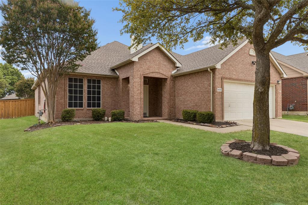 Discover comfort, convenience, and effortless living in this beautifully maintained one-story brick home nestled in the desirable Live Oak Village community of McKinney. Ideally located just minutes from shopping, dining, parks, and everything North Dallas has to offer, this inviting home combines timeless charm with everyday functionality. Step inside to a bright, airy interior featuring easy-care hard surface flooring throughout and an open, flowing floor plan filled with abundant natural light. The spacious living room welcomes you with a cozy gas fireplace with elegant glass doors, creating the perfect gathering place for relaxing evenings. It seamlessly connects to a formal dining area and a cheerful, sunlit kitchen boasting abundant cabinetry, generous counter space, and a sunny breakfast nook for casual meals. The tranquil primary suite serves as a private retreat with a spa-inspired ensuite bath featuring dual sinks, a relaxing garden tub, separate walk-in shower, and a spacious walk-in closet. Outside, the private fenced backyard offers the ideal blend of space and low-maintenance living, perfect for gardening, entertaining, or simply unwinding. Enjoy the exceptional amenities of nearby Stonebridge Ranch, including an aquatic center, beach club, tennis courts, scenic hike and bike trails, parks, and playgrounds. Conveniently located near highly rated schools, restaurants, and entertainment, this charming move-in-ready gem offers the perfect place to call home.