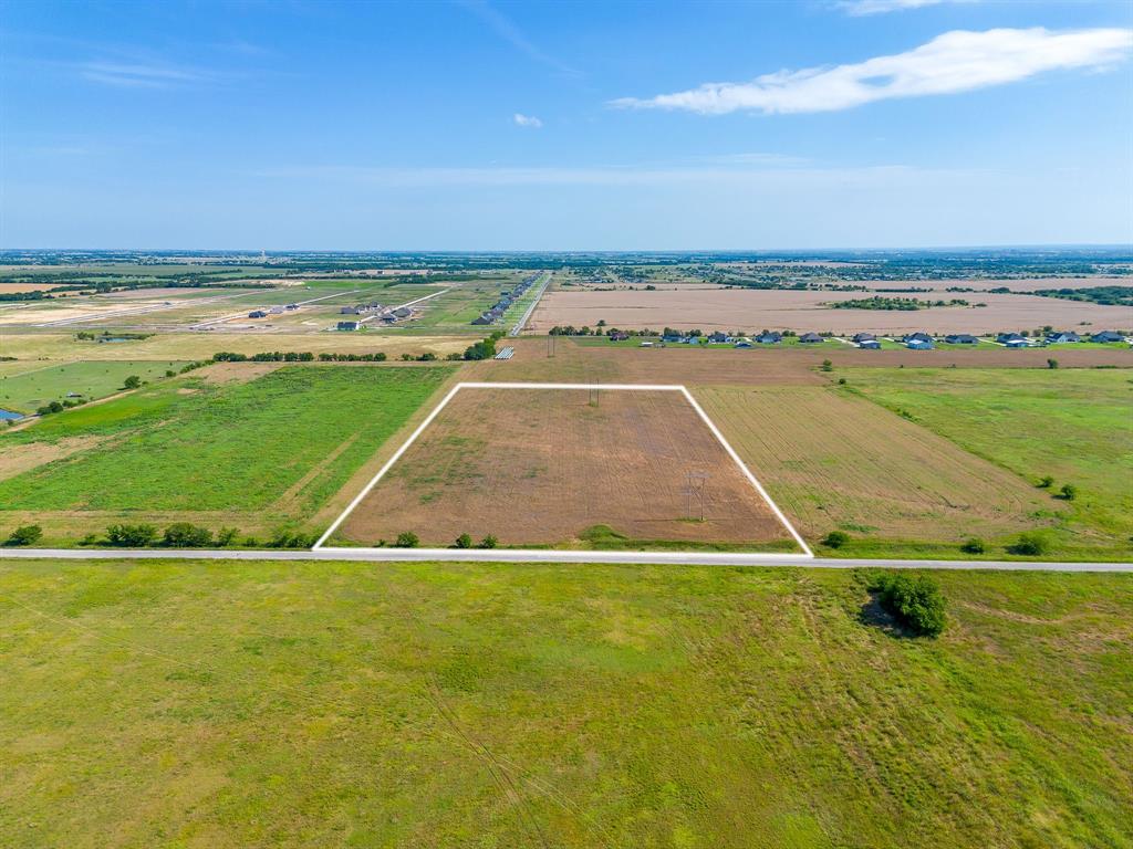 10.01 flat acres in the heart of Sanger ISD with an established ag exemption keeping your annual carrying costs at a bare minimum. Currently producing hay with a local farmer bailing the land, this property is ready to put to work the day you close. Whether you're looking to run horses, graze cattle, build your dream homestead, or simply hold a tangible asset in one of North Texas's fastest growing corridors, this land checks the box.

Deed restrictions are in place protecting your investment and ensuring the surrounding neighborhood develops with intention. Single family residential use, no manufactured homes, no commercial animal operations. The framework is there to preserve long term value.

Positioned with easy access to I-35 while sitting far enough off the highway to enjoy genuine rural quiet. The flat terrain is a significant advantage when you're ready to build, keeping site prep and foundation costs predictable. Sanger's schools, shops, and amenities are just minutes away, and the DFW Metroplex is well within commuting distance.

Raw land with this combination of location, utility, ag exemption, and price point doesn't last. Come walk it.