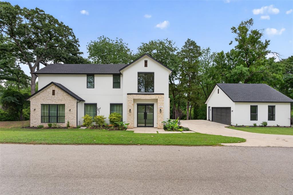 Welcome to luxury lakeside living in the exclusive gated community of Heather Woods on Cedar Creek Lake. This beautifully crafted home offers the perfect blend of elegance, comfort, and outdoor living, all set on a spacious lot with scenic lake views.

Designed with both everyday living and entertaining in mind, the open-concept floor plan features soaring ceilings, abundant natural light, rich hardwood flooring, and thoughtfully selected finishes throughout. The chef-inspired kitchen flows seamlessly into the main living area, creating a warm and inviting space to gather with family and friends.

The main level offers a private primary retreat complete with a spa-like ensuite bath and direct access to the covered outdoor living area. A secondary bedroom with its own private bath is also conveniently located downstairs. Upstairs, you’ll find two additional bedrooms, a full bathroom, and a versatile loft that opens onto a private balcony overlooking the surrounding landscape and lake.

One of the home’s standout features is its exceptional connection to the outdoors. The living room, kitchen, and primary suite all open directly to an overlooking the newly enhanced backyard. Recently improved for greater functionality and enjoyment, the outdoor space provides the perfect setting for morning coffee, evening sunsets, weekend gatherings, or simply relaxing while enjoying the peaceful lake atmosphere.

Residents of Heather Woods enjoy exclusive access to community amenities including a private boat ramp, fishing dock, fitness center, and walking trails. Conveniently located just over an hour from Dallas, this property offers the ideal opportunity for full-time lake living or a luxurious weekend retreat.

Additional opportunity: The lot directly behind the home is also available for purchase, providing added privacy, expanded outdoor space, or future possibilities.