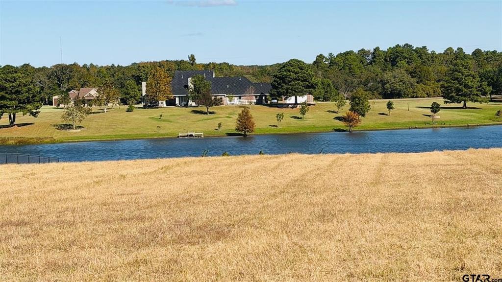 Don't miss out on one of the last waterfront lots in Stallion Lake Ranch! Imagine building a home on this large, 1.259 acre, waterfront property in Stallion Lake Ranch! This equestrian community in East Texas features community amenities for you and your horse(s): a barn office with restrooms, a community horse barn, round pen, arena, covered patio, basketball goal, pipe fenced horse pastures, walker, washing areas, and a tack room. This peaceful and serene neighborhood would be the perfect place to build your next home!