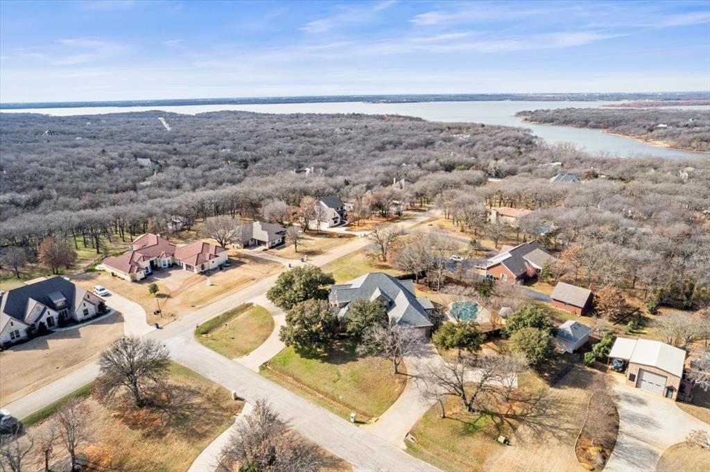 Owner offering $40,000 allowance to buyer for redecorating, intrest buy down or closing costs. Superbly crafted 2nd Owner Custom Home Situated On 1 Acre In Highly Sought Emerald Sound in Oak Point! Automatic Equity, Appraised for $1,234,000 December 2024! 2 primary bedrooms with private en-suites On 1st Floor! Main Primary w sitting room w luxury ensuite bath w marble topped vanities,custom cabinetry,shower for 2,jetted tub,bidet,2 custom designed closet dressing room that opens to a utility room with facilities for 2 washers & dryers,sink & extensive storage.Newly restored hardwoods at the front door & continue through the owner’s study, formal living & dining rooms,master suite,kitchen,breakfast area, great room & more. 2nd master w ensuite bath lies at the back of the home with a dramatic view of the grounds, pool & spa. Truly magnificent kitchen sports Wolfe appliances: six burner cooktop with ventilation, a convection oven and a chef’s steam oven. Granite countertops grace the custom cabinetry, an expansive island and a coffee bar. A Sub Zero built-in fridge completes it all. Up the winding stairs you’ll enjoy two additional bedrooms that share a Jack & Jill bath, loft game room & the media room. Outside, relax on one of two covered porches, swim in the sparkling pool or refresh in the bubbling spa w waterfall. Raised garden beds, or birdwatching from the comfort of the gazebo*Beyond the backyard, is a large storage shed for all the gardening equipment needed. Parking is ample with the circle drive in front, side driveway and RV parking pad as well. The well appointed oversized garage also has custom cabinetry, overhead storage, a work bench, utility sink and EV charger*SOLAR PANELS ARE FULLY PAID OFF & MAKE ELECTRIC BILL SUPER LOW*REPLACED HVAC 2026*TANKLESS WATER HEATER REPLACED DEC 2025*WATER HEATER REBUILT Aug 2025*Sprinkler System Uses Well Water*Underground Propane Tank Is OWNED*TANKLESS GAS WATER HEATER*RADIANT BARRIER*SAVE THOUSANDS!