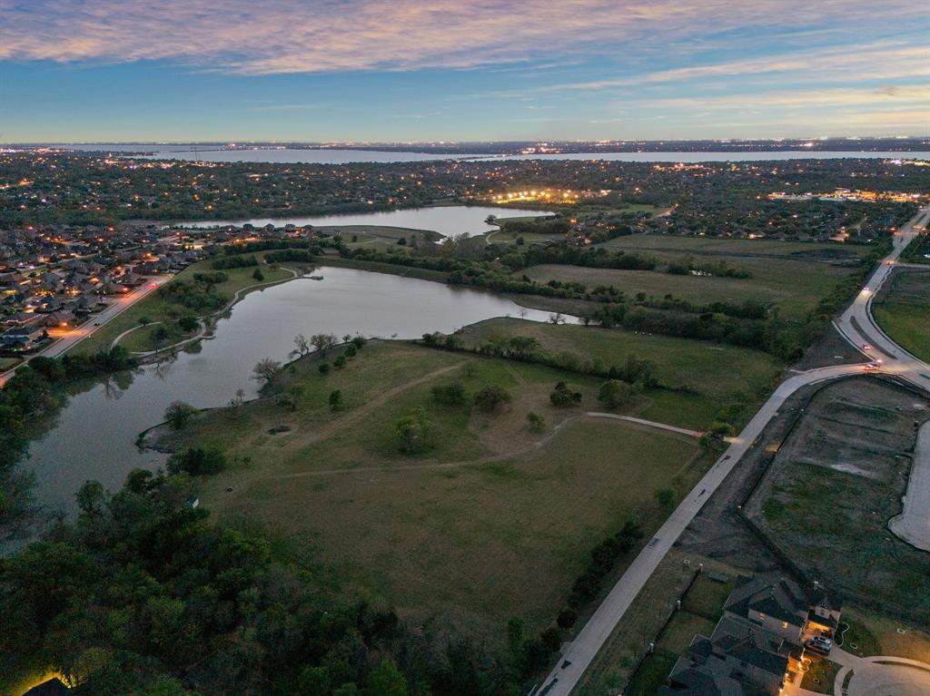 OPTIONS! #1) PURCHASE ALL 12+ ACRES & keep in AG Exemption as an investment or to build a single residence or Could be a DEVELOPMENT, (buyer would have to take it thru the City for approval) A buyer could contract a homesite fully contingent upon City Approval.  If current owner gets the 4 homesite Plat approved there would be deed restriction in place that are still yet to be determined but more than likely min sq footage would be 3500SF to 4000SF min. Shops or Barns would be allowed (per city requirements & code).  There is a rendering in photos that show what this could look like but is just an approx rendering, not exactly what would be approved. Contact agent for more details.  Utilities Gas, Water, Elect appear to be nearby, buyer to verify.