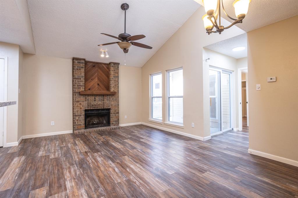 Perfectly located just a short walk to Lake Ray Hubbard, this single-story 2-2-2 townhome is ready for its new family! Open floor plan boasts light & bright with a modern contemporary feel!  The kitchen features updated cabinetry, nice countertops, tiled backsplashes, stainless steel appliances, and breakfast bar.  Kitchen & spacious dining area leads to a very spacious living room complete with vaulted ceiling and a cozy wood-burning fireplace! Gorgeous floors and ceramic tile-no carpet! Split bedrooms for added privacy! The primary suite boasts a single vanity with nice cabinetry, a separate shower and garden tub.  Outdoors you'll find a charming, grassy backyard secured by a privacy fence. This won't last long, so schedule your showing today!