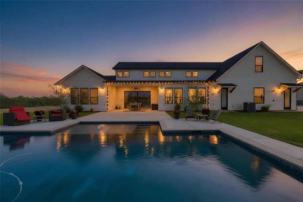 Welcome to 338 CR 4223 in Decatur—set on 10 ag-exempt acres with a pool, this custom modern farmhouse was designed for upscale multi-generational living and effortless entertaining. The home opens to a stunning great room with soaring 18-foot ceilings, seamlessly connecting the family room, kitchen, and dining area. The chef-inspired kitchen features a professional grade gas cooktop, a stunning custom vent hood, dual islands, abundant counter and cabinet space and premium finishes—built to gather and impress. The split-bedroom layout is smart and includes four bedrooms, with a private primary suite and guest suite on the main level, and two spacious secondary bedrooms upstairs. A total of five bathrooms includes three full baths & one half bath inside, plus a dedicated pool bath and outdoor shower. Three indoor living areas provide flexibility: the main great room with dramatic see thru fireplace, a sunroom (den) that shares the see thru fireplace while offering patio access, and an upstairs game room positioned over the garage for added privacy and noise separation. Two home offices offer versatility—one with a fireplace ideal for a study or library, and another with a secure safe closet for practical needs. Outdoors, enjoy a covered north-facing patio overlooking the pool that is backdropped by Texas sunsets! The EXTRA extras include an oversized three-car garage with EV capability, a 48x36 shop with electric & plumbing, a walk-in floor-to-ceiling shelved pantry w wine fridge, a spacious laundry room with a sink & utility storage, outdoor mosquito misting system, custom cabinetry, wood floors, layered interior lighting, thoughtfully planned outdoor lighting and a water softener system.
No restrictions except SWINE — bring your animals, RVs, ATVs, and more.
