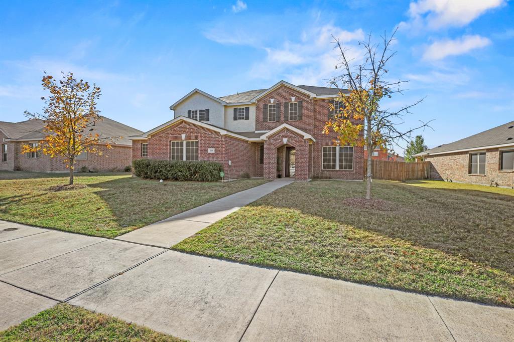 This charming two-story, 5-bedroom, 2.5-bath home has been immaculately maintained and offers plenty of space for comfortable living. It features three separate living areas, along with a covered patio that's ideal for morning coffee or hosting family gatherings and barbecues. The home boasts excellent curb appeal, and the upgraded flooring and spacious living room, complete with a fireplace, provide a warm and inviting atmosphere. The kitchen is well-appointed with an abundance of rich 42-inch cabinetry, a large walk-in pantry, a trash compactor, and a generous center island, making it perfect for entertaining. The master suite is a peaceful retreat, offering a private ensuite bath with double vanities, a garden tub, and a separate shower. Upstairs, the home offers a wonderful space for a growing family or guests, including a huge bonus room, four large bedrooms, and a full bathroom.