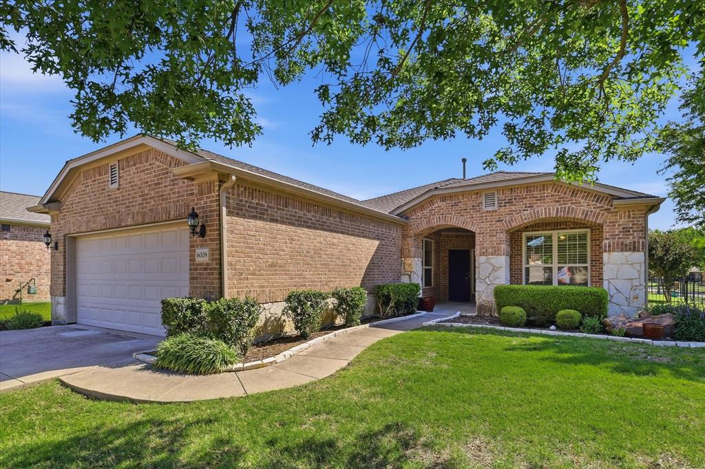 Picturesque Surrey Crest Model located in the sought after 55+ Community of Frisco Lakes. Not only is this home on a Corner Lot and adjacent to a Greenbelt, you have a lovely Water View of Lake Lewisville from the Large and Extended Patio and fully fenced backyard. The gourmet kitchen has a large island, stainless appliances, electric range, beautiful granite counters and pull outs in lower cabinets and a cozy Breakfast Room.  Easy to maintain tile floors in all of the Living Areas and Plantation Shutters throughout the home. The spacious Living Room offers plenty of room for entertaining. French doors lead to generously sized study with Plantation Shutters. Primary Suite has a walk in closet and an Ensuite Primary Bathroom with a Garden Tub and Walk In Shower. The Guest Bedroom and Bathroom are split from the Primary Suite for privacy. As a resident of Frisco Lakes, you'll enjoy resort style amenities across three village centers, including an Olympic sized indoor lap pool, beach entry outdoor pool, state of the art fitness centers, tennis, Pickle Ball and Bocce Ball Courts. You will have access to a championship 18 hole golf course. Make this your next home sweet home!