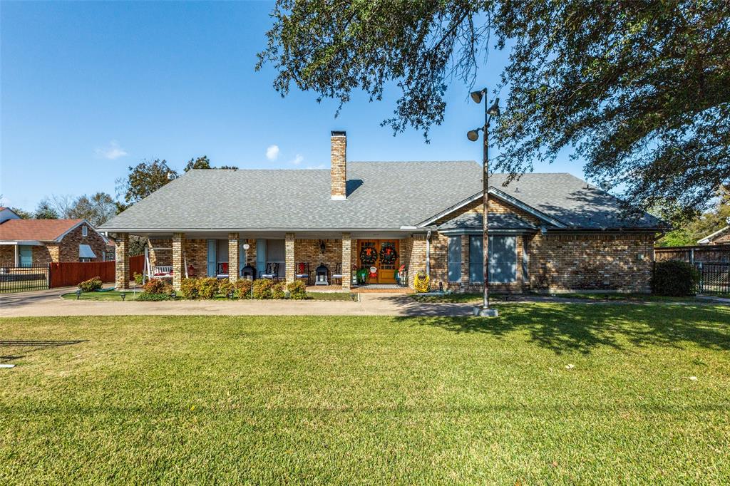 Discover a truly unique brick home in southeast Dallas—full of character, space, and thoughtful features. Built in 1977 and set on nearly half an acre, this property offers exceptional room to spread out both indoors and out, including parking for up to five vehicles with a 3-car garage plus covered carport and an electric gate for added convenience and security.   Inside, a dramatic floor-to-ceiling brick fireplace anchors the large living area with its vaulted ceiling and warm, inviting atmosphere. The generous dine-in kitchen offers abundant built-ins, plenty of prep space, and a stainless steel refrigerator that conveys with the home. You’ll also find a sizable walk-in pantry, a large utility room, and a dedicated bonus room perfect for crafting, hobbies, or home organization.   The single-level layout includes four bedrooms, two full baths, and two half baths. The expansive primary suite features dual closets and an ensuite bath with dual sinks. Upstairs, a spacious loft provides a second living area—ideal for a game room, playroom, media space, or private retreat—complete with its own half bath.   Located near Crawford Park and the popular Aquatic Center, this home offers both convenience and lifestyle appeal.  Close to Balch Springs Christian School and other private academies.  A rare find with this much function, character, and room to grow—come see all the possibilities it offers.