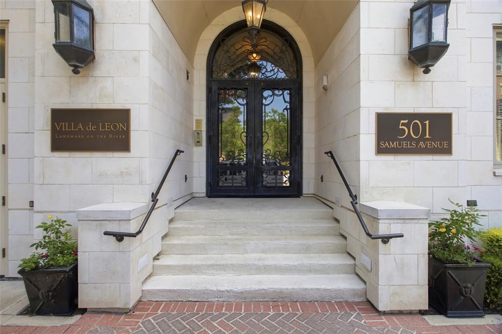 Location, Location and Spectacular Views! Experience luxury riverfront living at Villa de Leon, one of Fort Worth's premier condominium communities. This spacious end-unit residence is among the larger floor plans in the building and offers breathtaking panoramic views of both the downtown Fort Worth skyline and the Trinity River. Enjoy front-row seats to Fourth of July fireworks from your expansive covered balcony or through the home's dramatic floor-to-ceiling windows. During the holiday season, the sparkling downtown lights create a stunning backdrop from nearly every room. The open-concept floor plan features a generously sized living area with a gas fireplace, seamlessly connecting the kitchen, dining, and living spaces—perfect for entertaining or everyday living. The luxurious primary suite offers beautiful Trinity River views, a spacious bath with separate vanities, a jetted tub, oversized walk-in shower, and a large walk-in closet. Additional features include three full baths, granite countertops throughout, wood, marble, and carpet flooring, custom sun shades, and abundant storage with large walk-in closets. Villa de Leon residents enjoy exceptional amenities including 24-hour concierge service, a resort-style pool and spa, outdoor grilling and seating areas, a fitness center, and an elegant social room. Embrace the convenience of a lock-and-leave lifestyle while enjoying some of the most captivating views Fort Worth has to offer.