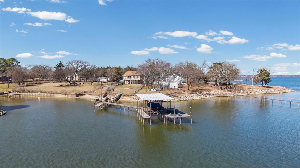 FRESHLY PAINTED EXTERIOR! All Buyers Now Welcome. Spectacular Lake View! This 4 bedroom 2.5 bath Lakehome boasts amazing views of beautiful Lake Tawakoni. Lake Tawakoni is a 38K-acre reservoir located in northeast Texas, about 48 miles east of Dallas. It is known for great fishing and recreation. This house is set for vacation rental or just a weekend home for retreat from the big city life. The long pier with fishing and boat dock make it an exceptional find. The electric boat lift makes getting into the water convenient and quick. 
SRA leaseback begins at back of house. 
No expressed or implied guarantees made in this listing. Buyer and buyer's agent responsible for due diligence.