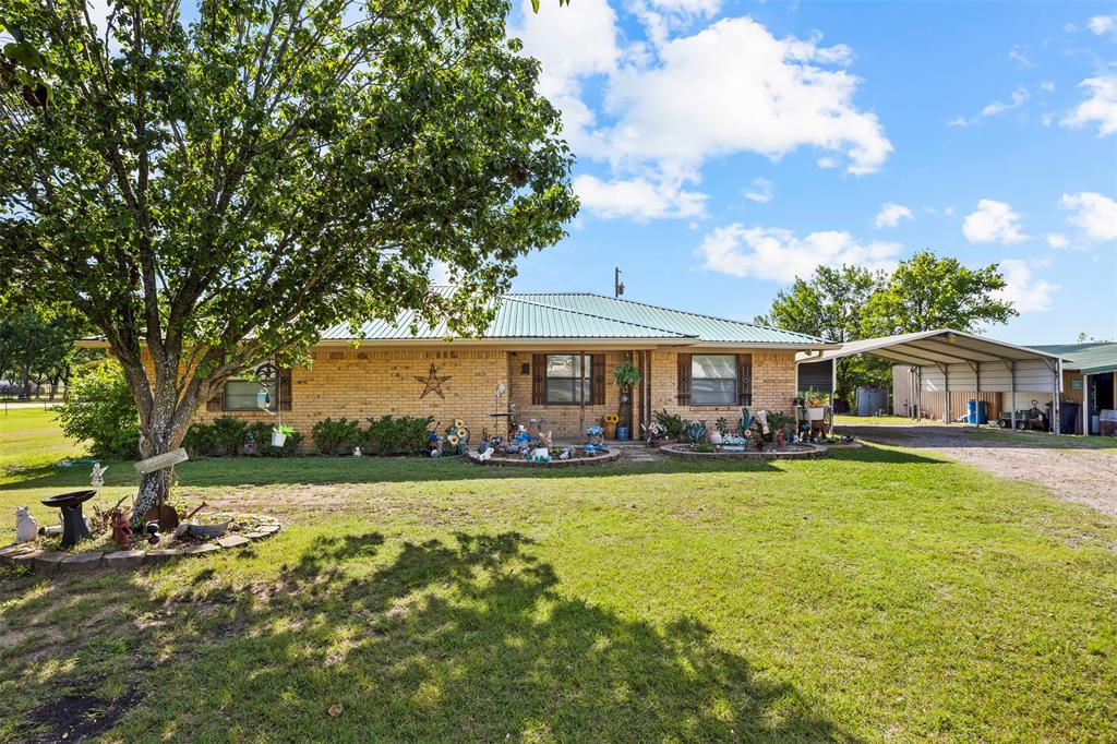 Rare opportunity to own 64 Ag-Exempt acres with a well-maintained home just 4 miles from I-45 in Ennis, Texas. Located outside the city limits and within Ennis ISD, this property offers the perfect combination of country living, ranch functionality, recreational use, and convenient access to Dallas, Waxahachie, Corsicana, and the greater DFW area.

The approximately 1,700-square-foot, one-owner home has been meticulously maintained since it was built and features 3 bedrooms, 2 bathrooms, a desirable split-bedroom floorplan, spacious living and dining areas, and a functional kitchen designed for everyday living. Pride of ownership is evident throughout the home, making it move-in ready for its next owner.

A two-car covered carport and a 19’ x 39’ metal shop provide ample space for equipment, vehicles, hobbies, storage, or ranch operations.

The 63 acres feature rolling terrain, scattered trees, a pond, native pasture, and fencing with cross-fencing already in place. Whether you’re raising cattle, keeping horses, running livestock, producing hay, hunting, fishing, riding ATVs, or simply enjoying the outdoors, this property offers the versatility and space to do it all. Each spring, bluebonnets and native Texas wildflowers add to the beauty of the landscape.

Whether you’re searching for a cattle ranch, horse property, recreational retreat, homestead, or investment in Texas land, this property delivers endless possibilities while maintaining easy access to major highways and nearby amenities. Properties offering this combination of acreage, Ag Exemption, ranch infrastructure, and location are becoming increasingly difficult to find.