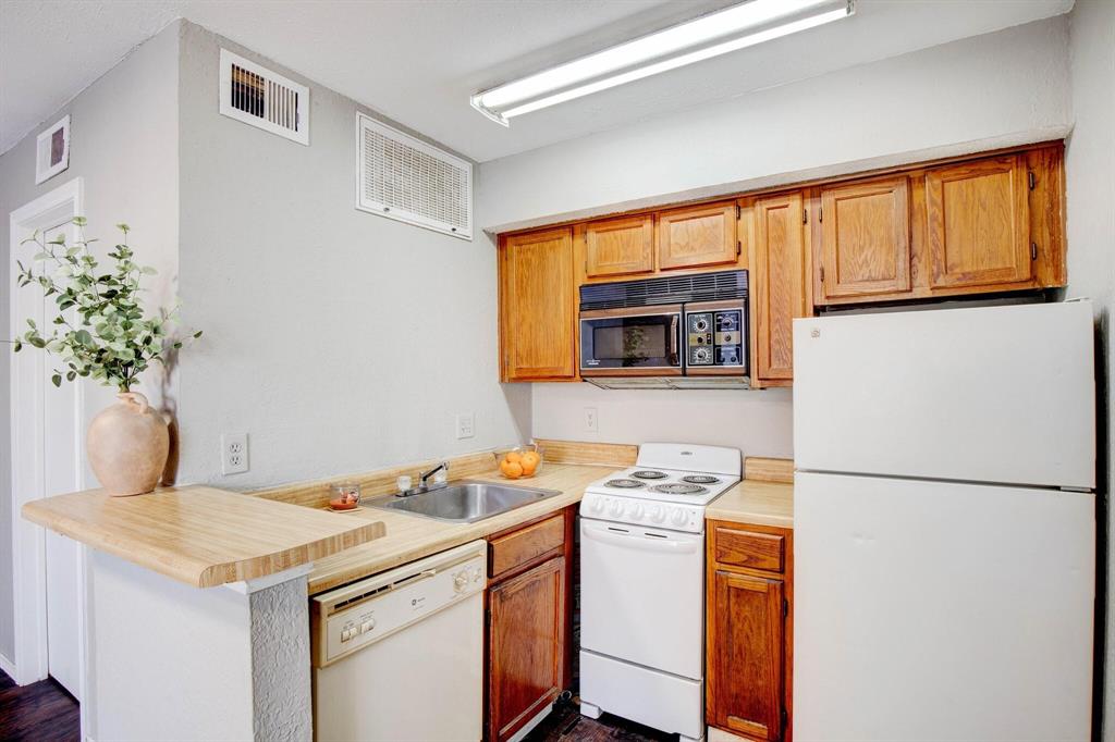 Cute condo with wood-look laminate flooring and a private balcony in Richardson ISD ! Refrigerator and stackable washer and dryer included. Low HOA dues. Large complex with community pool and tennis court. Convenient location near Richland college. Easy transportation options with a DART stop right at the front of the complex. What more could you ask for under $75,000.