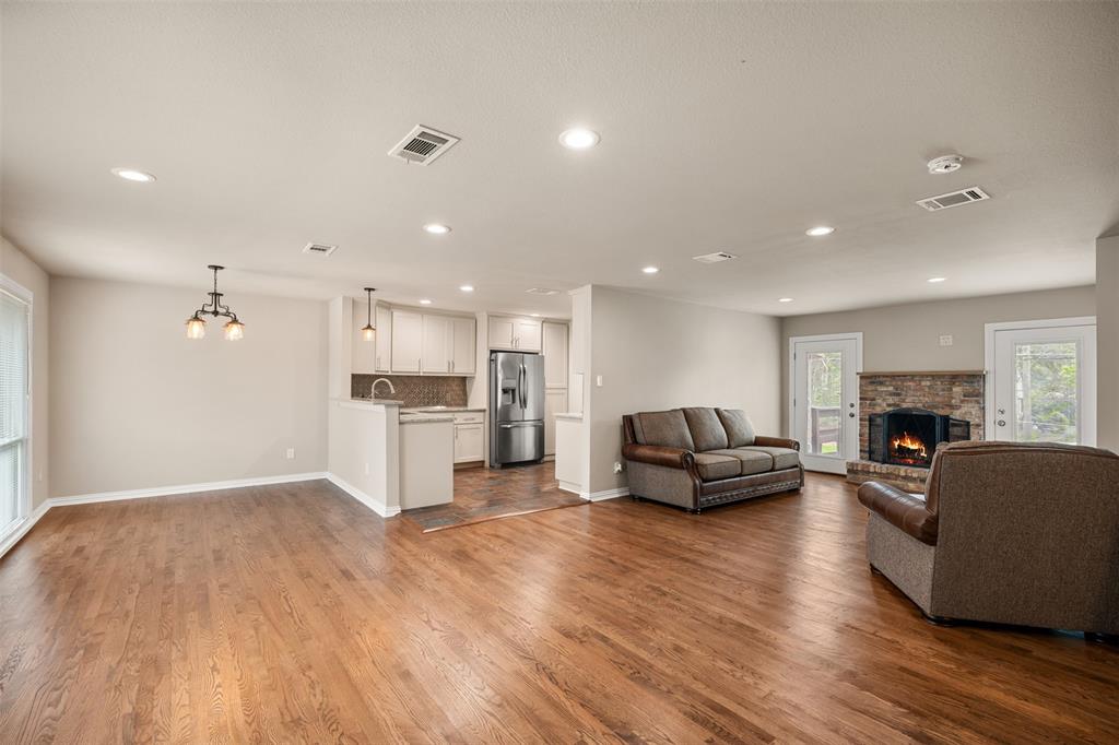 Charming Old Lake Highlands Home on a 10,000 sq ft lot near White Rock Lake. This 2-bed, 2-bath home offers character, function, and location with real hardwood floors, updated windows, custom kitchen cabinetry, granite countertops, and a wood-burning fireplace. Heated and cooled laundry area, insulated garage, detached storage building, and alley access with double gates add flexibility. Per seller, major improvements include updated electrical service, panel, wiring, insulation, roof, flooring, and interior updates. Seller also reports condenser replaced in 2015-2016 and interior HVAC replaced in 2022. Convenient to parks, trails, dining, and shopping.