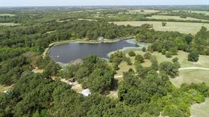 Perfectly charming and unique  property. 496+-Acres as breeding stock ranch located in SW Lamar Co. Ranch currently consists of multiple homes, cattle pens, 8 acre lake and some equipment. Main home 4 bedroom 2 bth with Open kitchen  perfect for entertaining. Very large living den with fireplace.   Large lake stocked with fish, as well as a deck and dock are right on sparkling clear water.  Shop RV storage, barn, equipment sheds. Enjoy our magnificent Texas sunrises and sunsets.   Homes are located on the shore of the lake and are surrounded by native stand of hardwoods which offer hunting opportunities including white tail deer, ducks, dove, and hogs.  Over a mile of road frontage. Currently owner operated.
