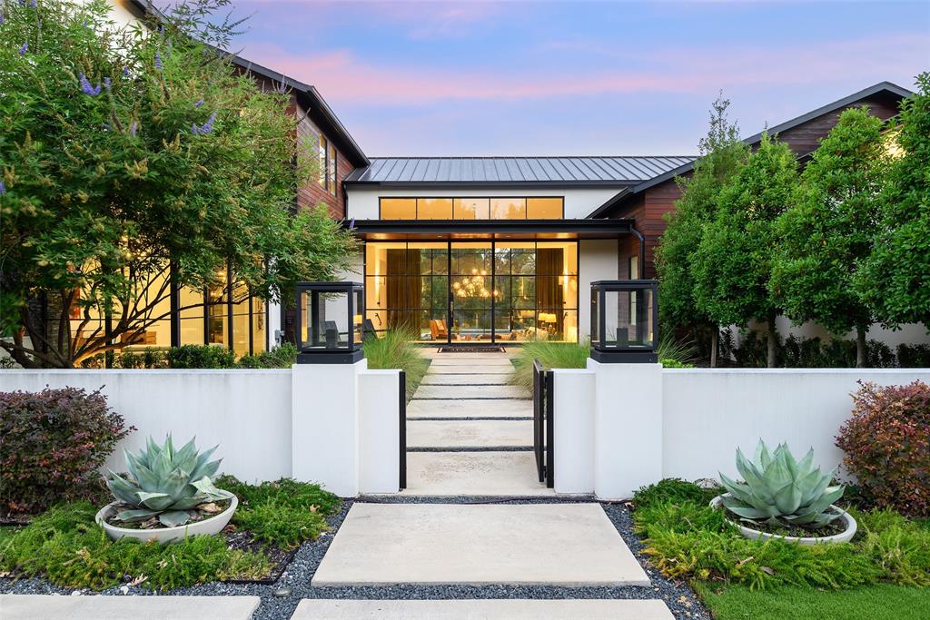 Nestled on over 1.33 acres of lush, private greenery, this stunning home is a one-of-a-kind retreat in the heart of Dallas. Designed by acclaimed firm M-Gray Architecture in 2019, this architectural masterpiece blends timeless elegance with cutting-edge design. Spanning more than 7,750 square feet, the home offers 6 bedrooms and 6.5 bathrooms, each thoughtfully designed with comfort and sophistication. Expansive glass walls and custom Mondrian-style windows flood the interiors with natural light, offering views of mature trees, manicured landscaping, and a serene creekside setting. The open-concept floor flows effortlessly from a dramatic great room to formal living and dining area into a chefs kitchen outfitted with premium stainless-steel appliances, custom cabinetry, quartzite countertops, and a waterfall-edge island. Additional features include a wet bar, chilled wine room, butler’s pantry, and a mudroom. The first level anchored by a primary suite with direct access to the resort-style pool. The spa-inspired primary bathroom boasts a soaking tub, walk-in shower, dual vanities, abundant natural light, and an expansive walk-in closet. Additional main-level highlights include multiple secondary bedrooms, dedicated office, spacious entertainment room, and an oversized three-car garage. Upstairs, en-suite bedrooms are accompanied by a second living area. Outdoor amenities equally impressive: resort-style pool and spa, covered cabana, firepit, full outdoor kitchen, a sport and pickleball court ideal for both entertaining and relaxation in your private oasis. Equipped with smart home technology for lighting, security, and automation, this home seamlessly integrates modern convenience with luxurious living. Surrounded by Dallas’ most prestigious private schools, and ideally located just minutes from major highways, DFW and Love Field airports, and premier shopping and dining, this estate offers the perfect blend of privacy, accessibility, and sophistication.