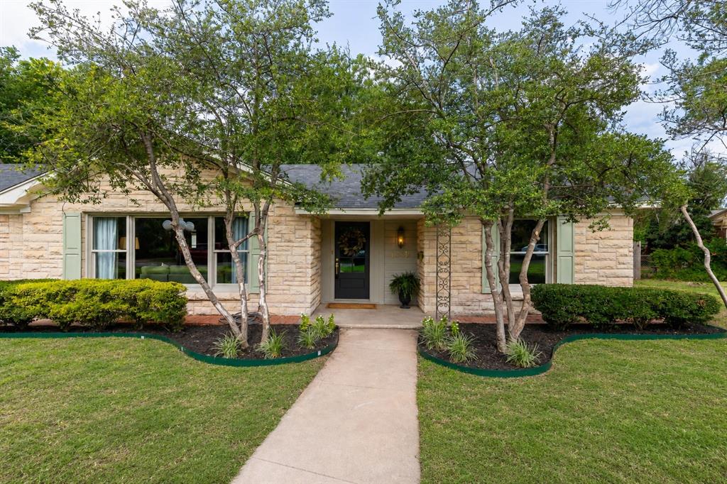 Welcome to Old Elmwood! One of Abilene's most sought-after neighborhoods & where this stunning home delivers the perfect blend of timeless character, thoughtful modern updates & designer selections worthy of envy! From the moment you arrive, the beautiful landscaping & curb appeal make an unforgettable first impression. Situated on a sprawling lot graced with large-mature trees that provide beauty, shade & an established feel that can't be replicated. Out back, the patio creates the perfect setting for entertaining or unwinding, & a rear-entry 2-car garage that could also be used as a great workshop space. 
Step through the new front door into a bright, open-concept living space anchored by gorgeous cherry hardwood floors that flow throughout the main areas. The layout is as functional as it is beautiful - open & airy where it counts, yet thoughtfully designed with a split-bedroom plan that gives everyone their own retreat. The kitchen has been outfitted with new stainless-steel appliances & a generous walk-in pantry that will delight any home chef. 
The primary suite is a true sanctuary with dual walk-in closets & a spa-like en-suite bathroom. Fully renovated with the kind of designer finishes that make getting ready feel like a luxury experience. The secondary bathroom has been equally well-appointed with the same elevated selections & attention to detail you'd expect to see in a luxury build. The updates go far beyond cosmetic. In recent years, significant investments in the home's core systems were made - replacing the roof, HVAC system, water heater, & electrical panel all in one fell swoop - giving tremendous peace of mind for years to come. Add to that, the new windows throughout, fresh interior paint from top to bottom, luxe designer fixtures & you have a home that is as sound as it is beautiful.
Homes of this caliber don't last. Here's your rare opportunity to own a character-filled gem where all the right updates have already been done for you.