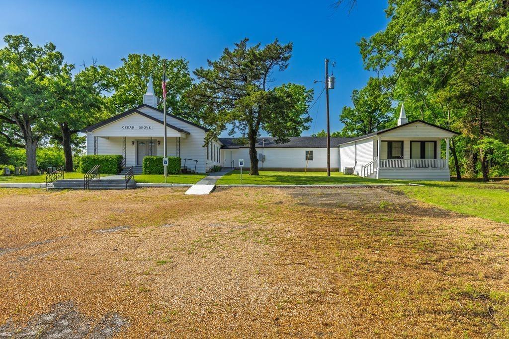 Historic Cedar Grove Church – Ready for Your Vision
Discover the charm and potential of Cedar Grove Church, a beautifully maintained property with roots dating back to 1898. Situated on a serene 2 plus acre setting adorned with majestic oak trees, this property offers endless possibilities for a congregation, wedding venue, private school, or retreat center—just minutes from I-30 and less than an hour from Dallas.
Main Sanctuary Building – Approx. 5,572 Sq Ft
This spacious building features:
• A large sanctuary perfect for worship or events
• Five versatile classrooms
• Separate foyer and fully pre-wired media room
• Pastor’s office
• Recently upgraded aerobic septic system
• Newer roof for added peace of mind
Fellowship Hall – Approx. 1,500 Sq Ft
• New appliances
• Tables and chairs included
• One-year-old roof
• Mounted 55-inch TV
• Upgraded electrical system
• New fire extinguishers
Additional Features:
• On-site cemetery with historic significance
• Large concrete pad (approx. 31x70) ideal for outdoor weddings or events
• 20x20 storage building with additional space
• Outdoor LED lighting for evening events
• Beautiful, quiet country setting with easy access to city conveniences
• Recent property survey completed
Whether you’re looking to grow a ministry, host unforgettable events, or establish a peaceful retreat, Cedar Grove is a rare opportunity with both character and modern updates.
The property is currently being leased to a church.
Schedule your private showing today!