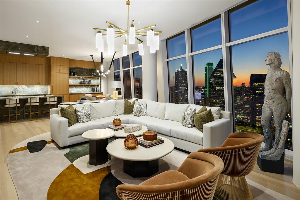 Completely reimagined with an extensive $2 million renovation completed in November, 2025. Positioned on the 35th floor of an iconic luxury high-rise, this extraordinary half-floor residence at Museum Tower offers unmatched sophistication and sweeping views. Encompassing 4,765 feet with floor-to-ceiling glass and twin terraces on the North & South caps, this is the only half-floor unit that offers a panoramic view of downtown Dallas. Every inch of this residence, with interiors curated by Studio Thomas James, showcase a seamless fusion of contemporary elegance & timeless materials. White oak flooring throughout, with custom millwork, gallery-finished walls, and full Lutron lighting & window shades. 
Open-concept living & dining spaces designed for grand entertaining or intimate living. Striking chef’s kitchen featuring bespoke cabinetry, induction cooktop, multiple refrigerator and freezer drawers, and an oversized island that serves as both centerpiece and gathering space. Stunning bar area with full size wine cooler & ice maker complete this gathering space framed by natural light.
Primary suite offers a tranquil retreat encompassing a study, sitting area, & spa-inspired bathroom finished in luxurious stone, designer fixtures, & custom vanities. Custom designed, expansive primary closet with glass front built-ins and island storage is noted as the bonus room. An elegant gallery hall, generous guest suite with private sitting, additional bedroom and bath, & expansive laundry with dual full-size W&D, complete the floorpan. 
Dedicated elevator access with a private entry, residents enjoy world-class amenities, white-glove services, and a premier location in the heart of the Arts District, walkable to the city’s finest dining, culture, and entertainment.
Seize this rare opportunity to own a meticulously upgraded residence where design, luxury, and breathtaking views converge in one of the city’s most coveted addresses. Also available for Lease: $28,000 per month