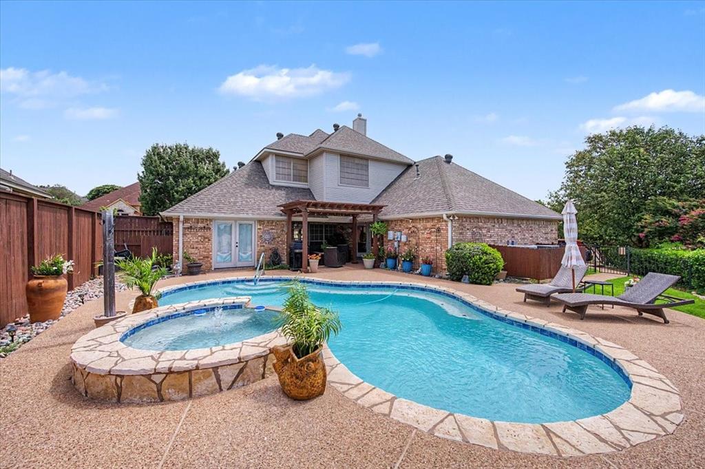 Stunning home near Eagle Mountain Lake!  On an oversized corner cul-de-sac lot; 4 bedrooms, 3 full and a half bath; Master suite downstairs features dual sinks, garden tub, separate shower and built-in cabinets; 3 bedrooms upstairs all with walk-in closets, 2 full baths and a loft area perfect for an office or study; Beautifully updated kitchen boasts granite countertops, natural stone accents, new gas cooktop and new hardwood floors (2026); See-through double-sided gas fireplace shared between living and family rooms adds warmth and charm; 2 living and 2 dining areas with built-in cabinets throughout; Backyard oasis features newly updated gunite pool with new tile and mastic (2025), stunning new rock waterfall and Trex deck (2026) — perfect for entertaining; Pergola adds to the outdoor living experience; Oversized utility room with sink.
; Side-entry 2-car garage; Covered patio, sprinkler system and rain gutters;  Move-in ready with all the updates already done — Too Good To Miss!  Optional membership to the Voluntary HOA unlocks access to a community boat dock and additional amenities — making this home ideal for those who love the water and outdoor lifestyle.  Go to LCPOA.org for more information about the Community Amenities.