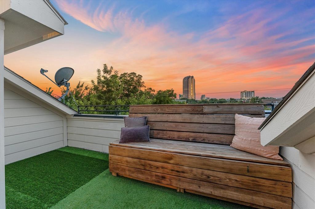 Rarely does an Uptown townhome offer BOTH a panoramic rooftop skyline terrace and a fully fenced private backyard retreat, all just steps from The Central, E Bar, Loro, and some of Dallas’ best dining and entertainment. Freshly painted and move-in ready, this sophisticated 3-story home blends elevated urban living with everyday comfort. The open-concept main level features hardwood floors, abundant natural light, expansive living and dining spaces, and seamless entertaining flow. The rooftop terrace offers panoramic Downtown and East Dallas skyline views with turf
accents and custom wood seating, creating the perfect space to entertain or unwind above the city lights. Down below, the private fenced backyard features a spacious Trex entertaining deck, turf yard, and tree-shaded privacy rarely found in Uptown living.

Upstairs, the vaulted-ceiling primary suite feels expansive and retreat-like with abundant natural light, a custom walk-in closet, oversized shower, and soaking tub. A secondary en-suite bedroom occupies the same level, while the first floor offers an additional bedroom, full bath, utility room, and direct backyard access ideal for guests, roommates, or a home office setup.

Additional features include motorized shades, Honeywell smart thermostats, Ring doorbell system, stainless steel appliances, washer and dryer included, 2-car garage, and multiple indoor-outdoor living spaces designed for both entertaining and functionality. Recent improvements include fresh interior paint, updated turf 2024, new water heater in 2024, and HVAC was replaced in 2023.

A rare opportunity to own a move-in-ready Uptown home delivering skyline views, private outdoor living, walkability, and a lifestyle that stands apart from anything else in the neighborhood.
