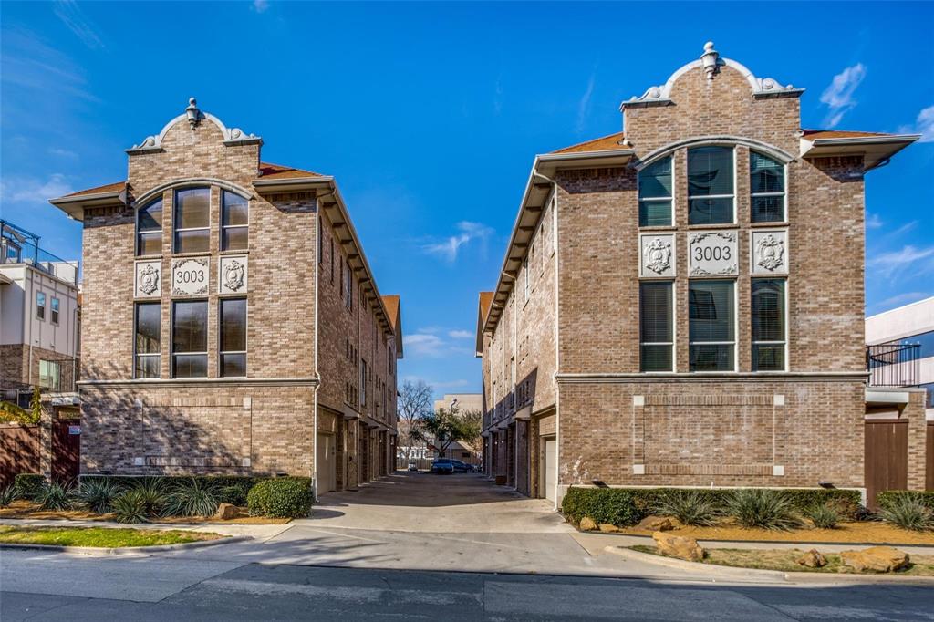 Tucked into the heart of Oak Lawn, this thoughtfully designed 3-story condo offers an ideal blend of flexibility, style, and low-maintenance living. With 2 bedrooms, 2.5 bathrooms, and a private rooftop patio, the layout lives larger than expected and works beautifully for roommates, guests, or a work-from-home setup. The first floor features a private secondary bedroom with an ensuite bath, and access to a fenced turf yard and patio, perfect for pets, entertaining, or just relaxing outdoors. The second level is the main gathering space with an open-concept kitchen, living area, and half bath. Granite counters, all-gas appliances, and updated light fixtures give the kitchen a clean, modern feel. On one side of the kitchen, a window replaces a traditional backsplash, letting more natural light into the space. The entire home was repainted in 2026. The third-floor primary suite offers a private retreat with a spacious bedroom, oversized walk-in closet, and private bath. The rooftop patio offers another outdoor living space with room to relax or entertain while taking in the open air and city views, and includes a storage room. Additional highlights include a 1-car garage, a tankless water heater installed in 2026, and an HOA that covers roof, gas, water, trash, and exterior maintenance for easy lock-and-leave living in one of Dallas’ most walkable and connected neighborhoods. A smart garage door opener and doorbell security camera both stay with the house as well! A rare opportunity in this exclusive Oak Lawn complex!