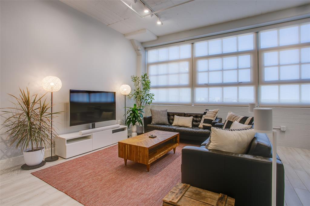 SELLER OFFERING THREE MONTHS of HOA DUES.  Luxury condo offering the lock and leave lifestyle at its best, located within a historic loft setting.  Updated paint, flooring and lighting prior to listing.  Enjoy all the amenities of a traditional highrise in a contemporary fashion – 24-hour concierge, secured door entry and garage, gorgeous rooftop pool and amenity deck featuring multiple cabanas, outdoor kitchen and grilling areas, putting greens, a gym, and media room – even a gated dog run!  Excellent view of the pool from the unit. Target, Tom Thumb and Natural Grocers are right outside the door and you are within literal minutes to Downtown, TCU, the Cultural District, Trinity Trail, the FW Zoo, Botanic Gardens, Dickie’s Arena, the Stockyards...all this and easy access to I-30, I-35, Hwy 121!
