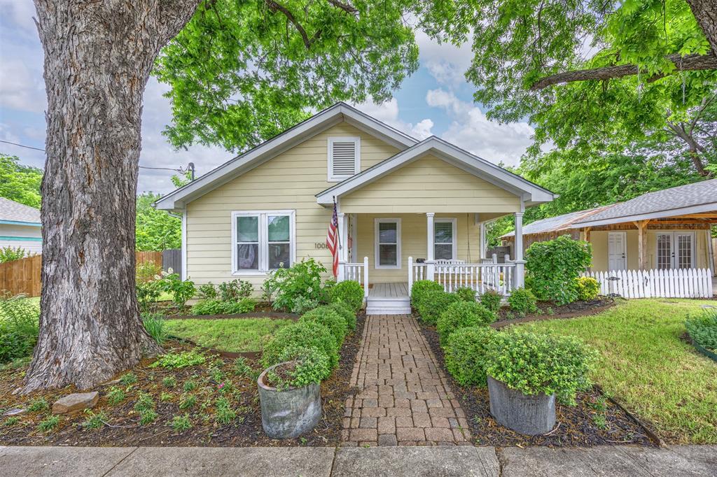 Nestled on a quiet, tree-lined street in the heart of historic downtown McKinney, this enchanting 4-bed, 2-bath residence beautifully blends timeless character with thoughtful modern updates. Rich in charm & lovingly maintained, the home offers an inviting atmosphere designed for both comfortable living & effortless entertaining. Inside, spacious living areas are filled with abundant natural light, creating a warm & welcoming ambiance throughout. The beautifully updated galley kitchen is as functional as it is stylish, offering an ideal space for hosting gatherings or enjoying everyday meals. Expansive windows surrounding the dining area flood the space with sunlight. The Primary suite serves as a private retreat, featuring soaring ceilings and a spa-inspired en-suite bath complete with ocean-blue tile accents, a generous walk-in shower, clawfoot soaking tub, and refined finishes. Adjacent to the primary suite, a beautifully designed office studio creates an ideal space for remote work, creative pursuits, or a private lounge. Three additional bedrooms are spacious, comfortable, and full of personality, offering flexibility for guests or family living. Outdoor living is equally exceptional, with inviting front and back porches that create the perfect backdrop for relaxing evenings with friends and neighbors. The expansive backyard is shaded by mature trees and features a large deck complete with space for grilling, dining, and gathering around the chiminea—perfect for creating lasting memories year-round. Native Texas landscaping and vibrant crape myrtles provide stunning seasonal beauty and exceptional curb appeal. Located just moments from the vibrant attractions of downtown McKinney, this home offers the rare opportunity to enjoy historic charm, modern comfort, and an unbeatable location—all while tucked away from the bustle of downtown traffic. See documents in Transation Desk.  Schedule showings in Broker Bay
