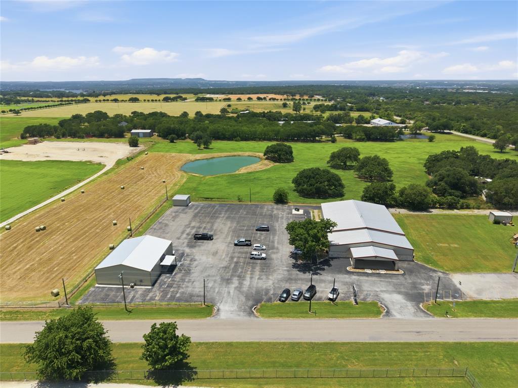 Rare opportunity to acquire a fully stabilized, and completely occupied investment property anchored by two established fitness businesses with long-term leases extending through 2034. The property offers predictable cash flow, scheduled rent escalations, minimal management requirements, and strong long-term appreciation potential in one of Granbury's growing commercial corridors. Position your portfolio with a fully stabilized, income-producing commercial asset at 2420 Bob White Drive, Granbury, Texas. The property consists of approximately 13,000 square feet of commercial
improvements situated on 2 acres, offering ample parking, modern infrastructure, and an additional storage building with future income potential.