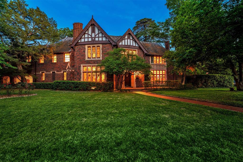 Introducing a stunning piece of rich history, a Tudor Estate nestled in the heart of Kessler Park. Built in 1931 for Louie Kimple of Dixico, this remarkable home exudes authenticity boasting magnolia wood trim w-hand crafted details, Italian stained glass windows, plaster ceilings with custom art lighting creating a timeless atmosphere. Enjoy a stately living room, formal dining, parlor, study, large kitchen & a one of a kind dance hall. With 5 bedrooms, this estate has plenty of room for family & guests. The expansive primary suite features ensuite bath w-steam shower & seating area with tree views, multiple balconies overlook lagoon style pool & a huge Deodara cedar tree. Designed to entertain w-covered & garage parking for 6 cars, large covered patio & lush grounds surrounded by 10-ft concrete wall creating a private oasis. The home's rich history is evident in every detail - truly a one-of-a-kind property that must be seen to fully appreciate. Don't miss out on this amazing home!