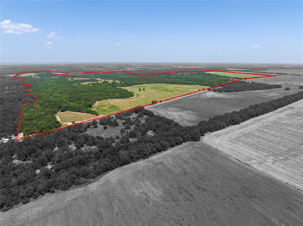 Approximately 650 acres of Scattered Trees, Hills, Sloped terrain and Rocky places along with a LOT of Wildlife, Over a mile of Highway frontage just west of Honey Grove Texas and approximately 4.5 miles as the crow flies to Bois d arc Lake where many in the metroplex are flocking for their new Summer Getaway. Great opportunity to own a large investment tract for the future growth. Property has for years been a very desired hunting spot for those allowed to get access. Be the new owner that gets to sell it by the foot instead of by the acre. Recommending a side by side ATV for viewing to be more of a hands on experience.