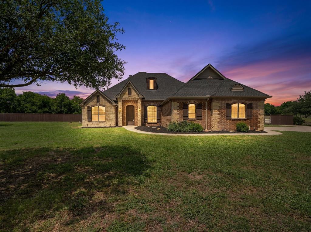 Welcome home to Sanger’s coveted, Hunnington Ridge. Nestled on over 2 acres, this custom traditional-style home offers the perfect blend of country living and refined comfort. Inside, you’ll find beautiful hand-scraped wood flooring, slate tile, crown molding throughout, solid core doors, and abundant windows that fill the home with natural light. The open-concept living area features a stunning floor-to-ceiling stone fireplace and overlooks the fully enclosed and air conditioned sunroom. The kitchen is designed for gathering with granite countertops, custom cabinetry, a large island, eat-in bar area and spacious breakfast room. The oversized primary suite includes dual sinks, a separate jetted tub and walk-in shower, and large walk-in closet. Three spacious secondary bedrooms - two share Jack and Jill bathroom on East side of house and the third has it's own bathroom on the West side. Don’t miss the hidden closet behind the bookshelf in the front West side bedroom. Outside, enjoy a massive backyard, with extended driveway and a 36x36 two-story barn,workshop with electric and rough plumbing. 50amp service available for RV. Other features include an oversized 3-car garage with enclosed 3rd car space currently used as an external office, and 2 tankless water heaters