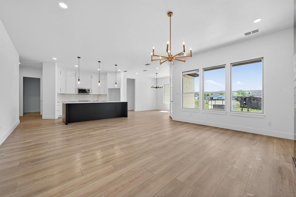 Welcome to this stunning New Build 4-bedroom, 3 full bathroom single-story custom home nestled in the peaceful community of Lone Oak, Texas. Perfectly blending country charm with modern comfort, this beautiful home offers the ideal setting for families seeking space, style, and serenity. Step inside to discover an inviting open-concept layout with generous living areas, high ceilings, and abundant natural light throughout. The spacious living room features a cozy fireplace that flows seamlessly into the dining area and chef’s kitchen, completed with quartz counters and a center island, stainless steel appliances, and ample cabinet space with upper showcase cabinets—perfect for everyday living and entertaining. Designed for modern living, the home features a dedicated private office ideal for remote work. The private primary suite is a true retreat, offering a spacious bedroom, a spa-like en-suite bath with dual vanities, a soaking tub, a separate walk-in shower, and a large walk-in closet. Three additional bedrooms are generously sized and share a full hall bath. This home also includes a dedicated laundry room, two-car garage, and thoughtful finishes throughout, including stylish flooring, neutral color palettes, and energy-efficient systems. Enjoy peaceful Texas evenings in the large backyard with a covered patio with a ceiling fan. Situated on a half-acre lot in a newly developing neighborhood with easy access to local schools and I-30 for a quick commute to Greenville, Rockwall, and the DFW Metroplex. Whether you’re upsizing or settling down, this move-in-ready gem offers the perfect blend of rural tranquility and modern amenities.  The property faces a tranquil pond, offering picturesque water views! Don't miss your chance to own a piece of Lone Oak charm. Schedule your private showing today!