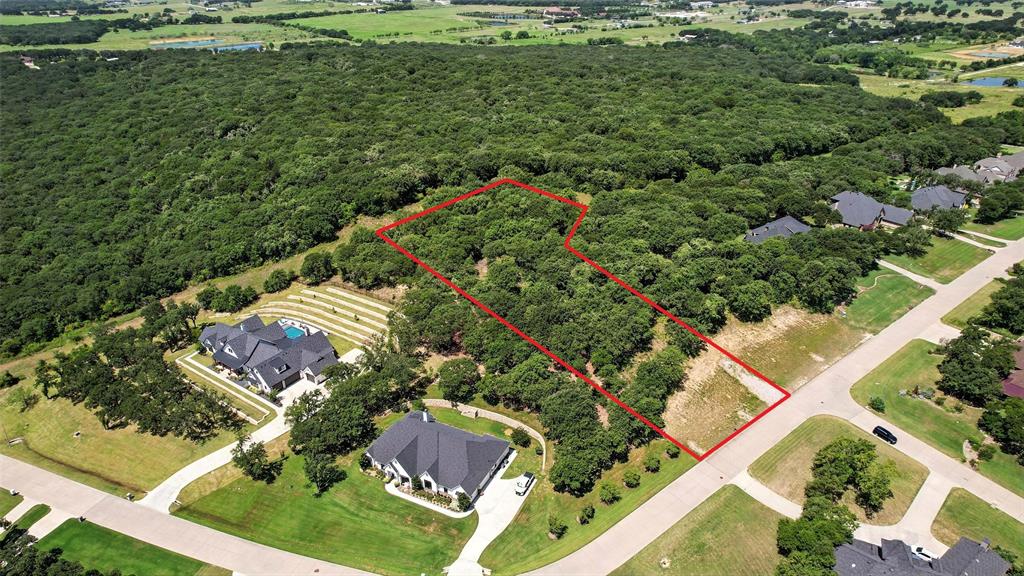 Build your dream home on this 1.129-acre lot in an upscale, subdivision spanning over 153 acres. This community is perfectly tucked away in a quiet, rural setting with native trees, rolling hills, and high elevation that captures beautiful views. Enjoy over 25 acres of scenic greenbelt featuring walking trails, a serene pond with a flowing fountain, and winding concrete streets that blend naturally with the landscape.

Bring your own builder and create a custom home that fits your vision! The neighborhood offers the convenience of Burleson city sewer and Johnson County water, and is located within Joshua ISD (buyer to verify schools and taxes). Don’t miss this rare opportunity to own a spacious lot in a peaceful yet upscale community with the perfect balance of nature and modern amenities.