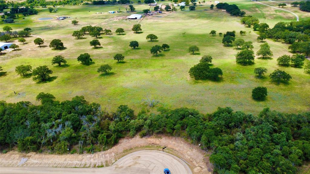 VH Ranch Estates is a new Parker County subdivision located in the highly acclaimed and sought after Peaster ISD.  Located just 7 miles from Peaster schools and 13 miles from Weatherford, you’ll find convenient and quick access to all the amenities that you desire.  VH Ranch Estates is bordered by one of Parker County’s most pristine horse and cattle ranches which adds an important layer of privacy for those looking for quiet country living.  The diverse landscape hosts a wide range of lots that include scattered mature trees, native pasture, and dense hardwood trees.  Lots vary from level to one that boasts one of the highest points in Parker County which provides extraordinary panoramic views of the countryside. The development has no HOA, but conservatively responsible restrictions are in place to protect and enhance your investment.  VH Ranch Estates invites you to bring your own builder.  Multiple lots within the 33 lot subdivision are available.